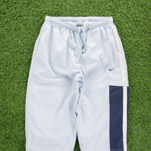 Load image into Gallery viewer, (2004) Women’s Nike Small Swoosh Embroidered Pocket Taping Adjustable Light Blue 3/4 Length Shorts - M (30-33”)