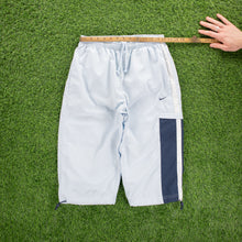 Load image into Gallery viewer, (2004) Women’s Nike Small Swoosh Embroidered Pocket Taping Adjustable Light Blue 3/4 Length Shorts - M (30-33”)