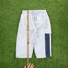 Load image into Gallery viewer, (2004) Women’s Nike Small Swoosh Embroidered Pocket Taping Adjustable Light Blue 3/4 Length Shorts - M (30-33”)