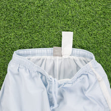 Load image into Gallery viewer, (2004) Women’s Nike Small Swoosh Embroidered Pocket Taping Adjustable Light Blue 3/4 Length Shorts - M (30-33”)