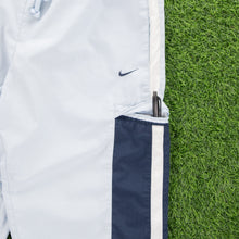 Load image into Gallery viewer, (2004) Women’s Nike Small Swoosh Embroidered Pocket Taping Adjustable Light Blue 3/4 Length Shorts - M (30-33”)