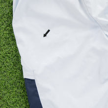 Load image into Gallery viewer, (2004) Women’s Nike Small Swoosh Embroidered Pocket Taping Adjustable Light Blue 3/4 Length Shorts - M (30-33”)