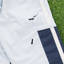 Load image into Gallery viewer, (2004) Women’s Nike Small Swoosh Embroidered Pocket Taping Adjustable Light Blue 3/4 Length Shorts - M (30-33”)