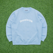 Load image into Gallery viewer, Women’s Reebok Spell Out Embroidered Logo Pullover Crewneck Light Blue Sweatshirt - L/XL (16-18)