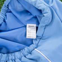 Load image into Gallery viewer, Women’s Reebok Small Spell Out Embroidered Pocket Piping Light Blue 3/4 Length Shorts - M (10-12)